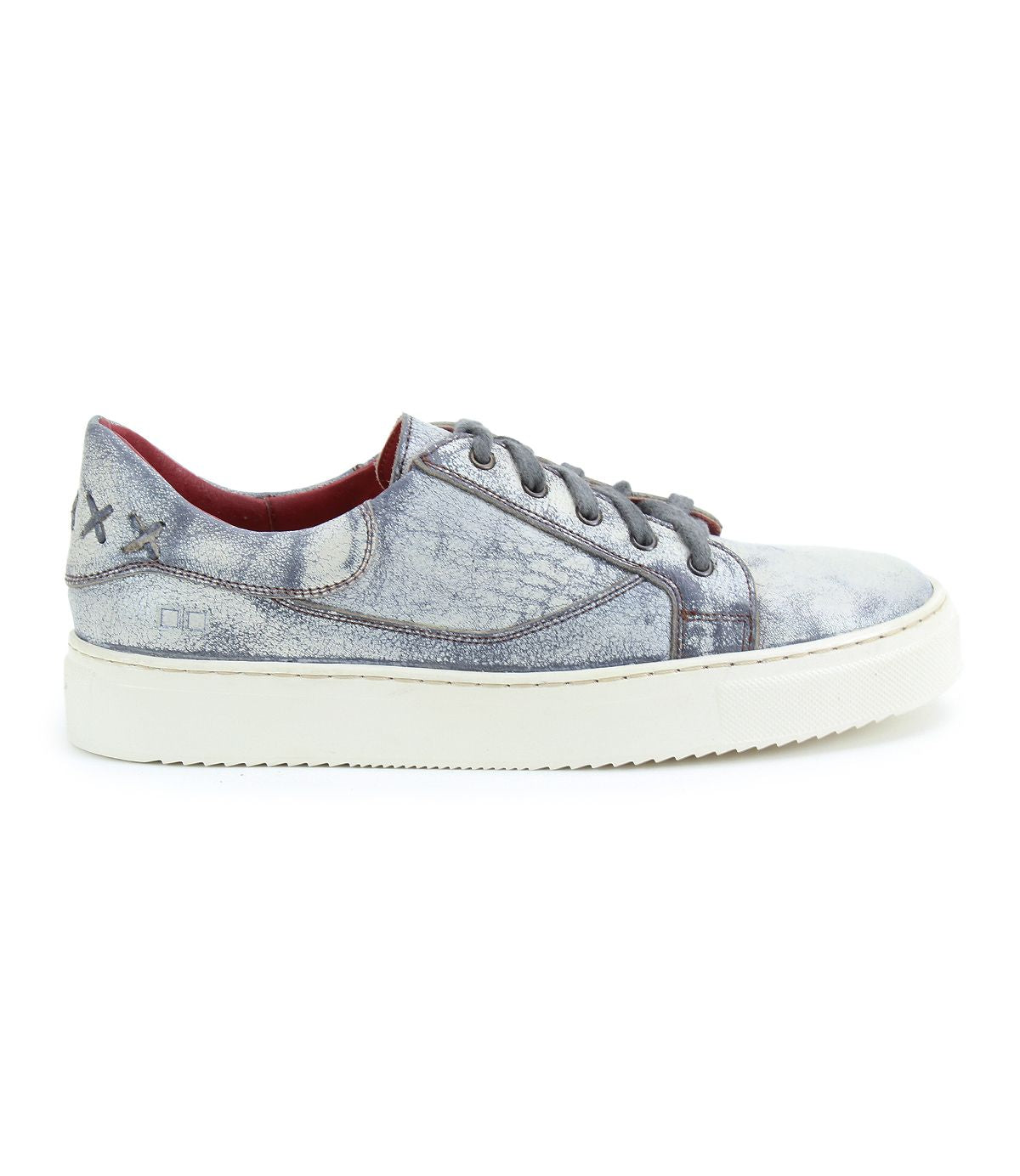 Side view of a single Azeli sneaker by Bed Stu, featuring a gray leather design with white soles and decorative stitching on the side, exemplifying modern style.