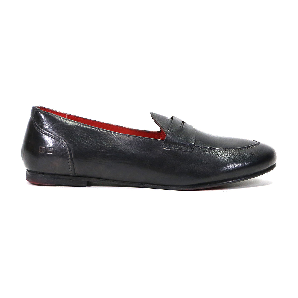 Black leather penny loafer with a red interior, displayed against a white background from Bed Stu.