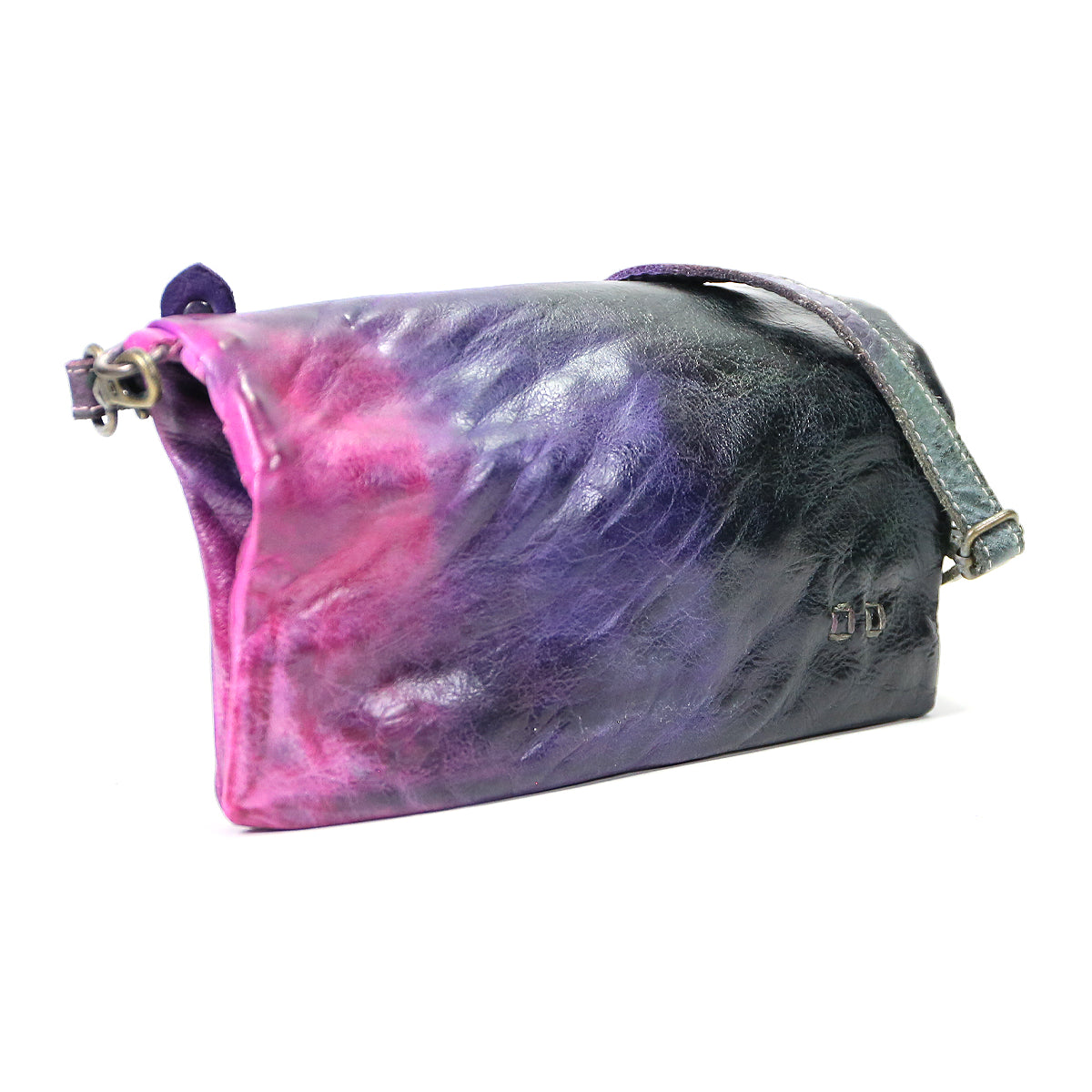 A small iridescent Cadence makeup bag with a pink and purple color gradient and a metal magnet closure, set against a white background by Bed Stu.