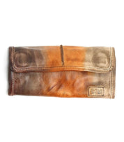 The Canton by Bed Stu is a two-tone leather wallet that can also be used as a 2-in-1 clutch, with a rectangular metal logo plate on the bottom right corner.