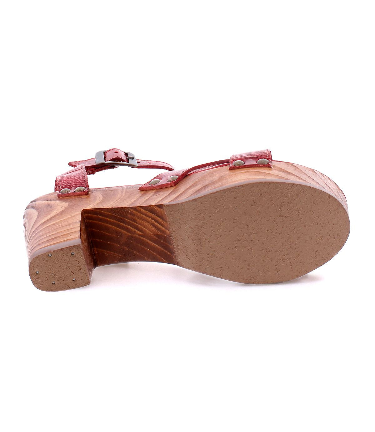 The image showcases the bottom view of the Kalah sandal by Bed Stu, featuring a wooden platform, buckle strap, and red upper material, exuding timeless elegance.