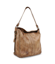 The Packet LTC by Bed Stu is a stylish brown leather shoulder tote bag featuring decorative stitching and stud accents, perfect for chic travel.