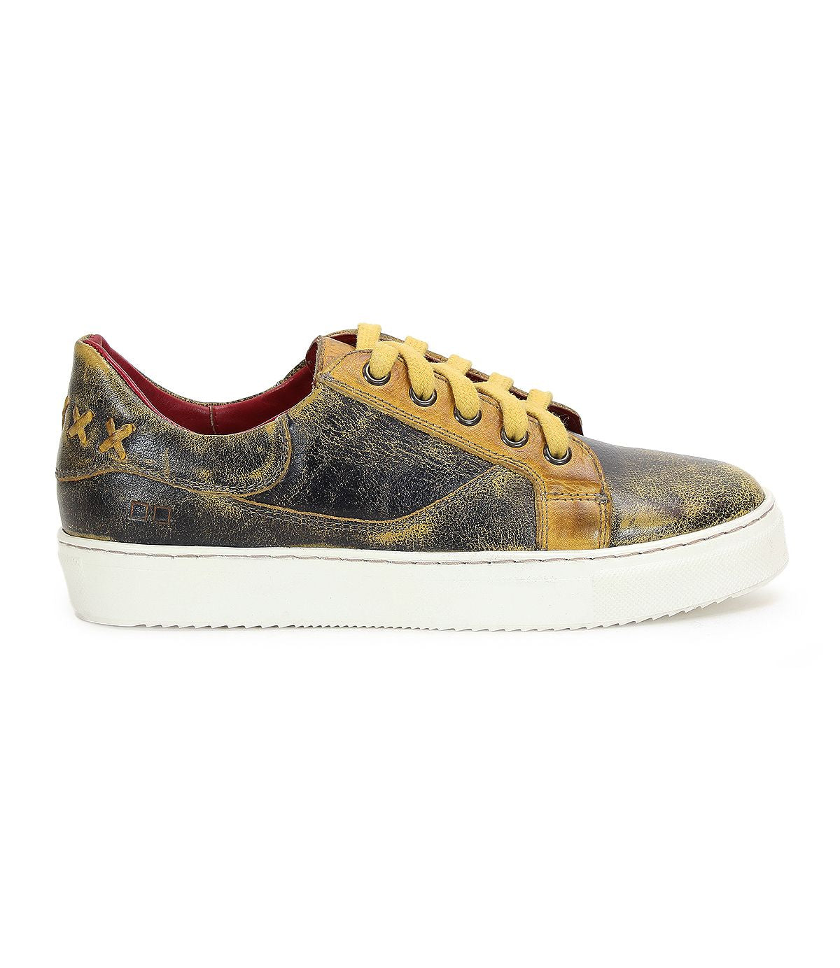 Side view of a worn-out Azeli sneaker in black and yellow with white soles and yellow laces. This low-profile shoe by Bed Stu features a padded collar, rounded toe, visible scuff marks, and a textured, distressed look.