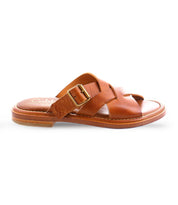 A brown slip on Italian leather sandal with a gold buckle product shot.