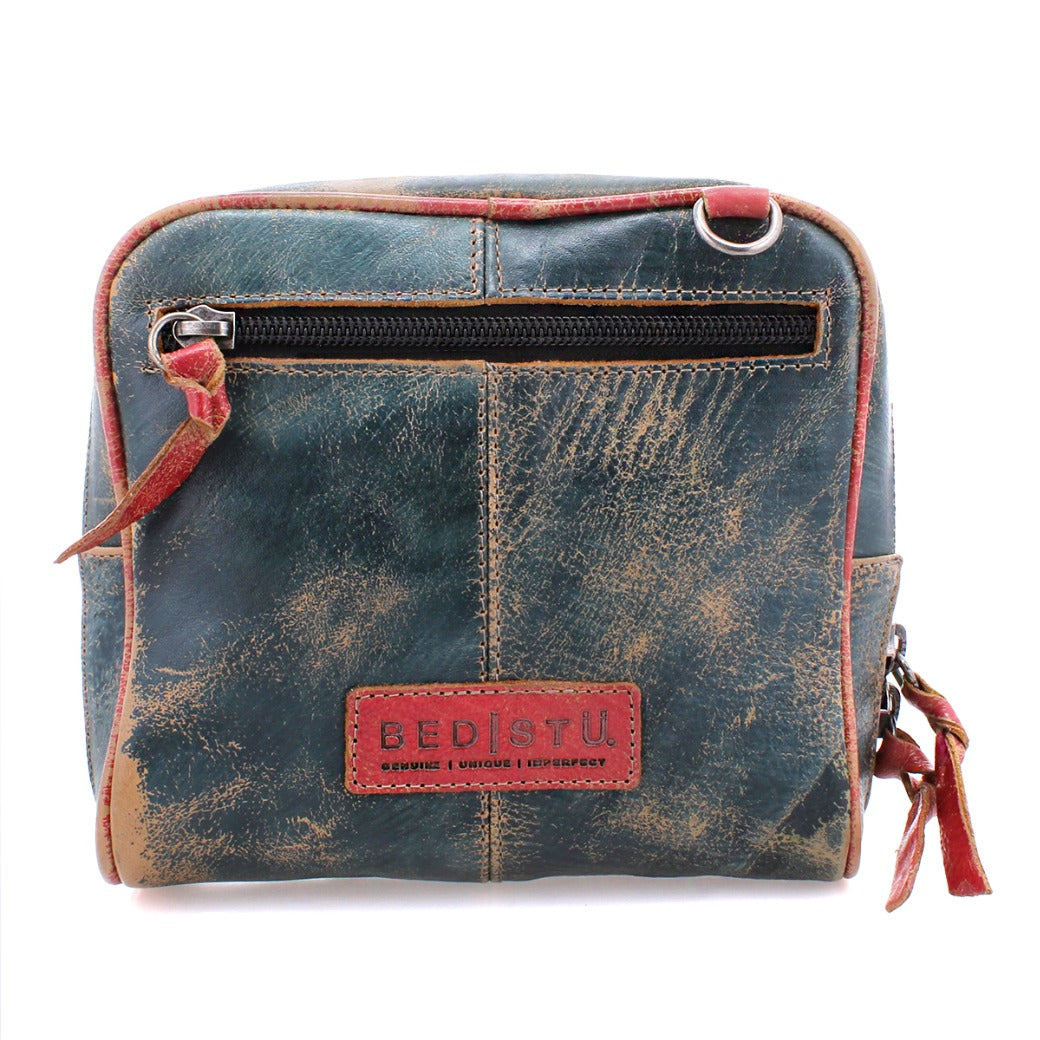 A blue and red Capture leather purse with a zipper by Bed Stu.
