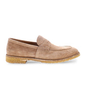 The Envoy by Bed Stu is a beige suede loafer featuring a flat brown sole and slip-on design, with minimal stitching details and a sleek profile, exuding timeless sophistication and Italian elegance.