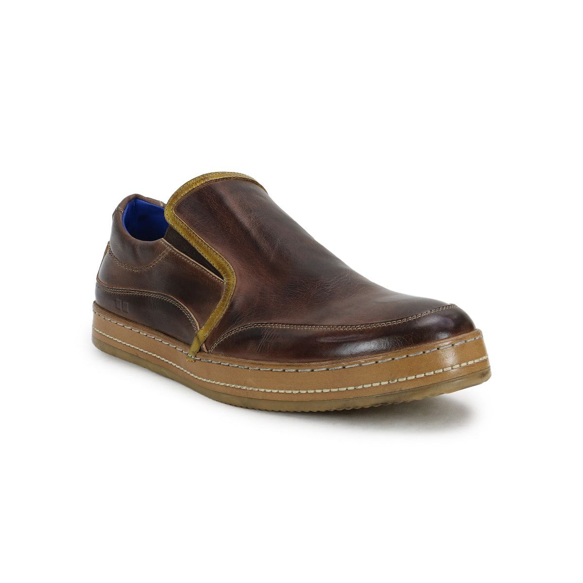 Freestyle by Bed Stu: a brown leather slip-on shoe featuring a contrasting light brown sole and side trim, radiating casual sophistication with a stylish blue inner lining.