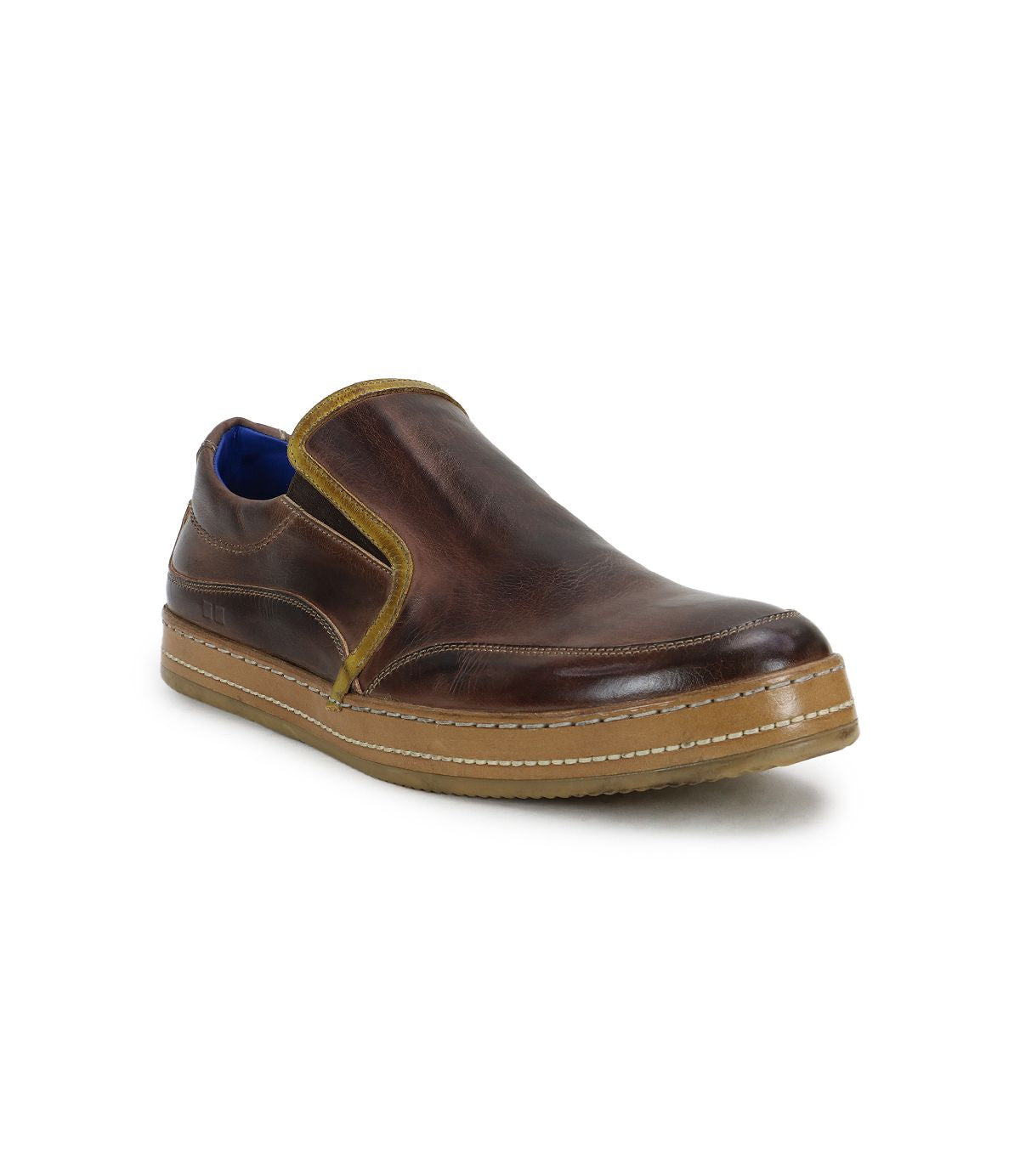 Freestyle by Bed Stu: a brown leather slip-on shoe featuring a contrasting light brown sole and side trim, radiating casual sophistication with a stylish blue inner lining.