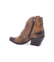 Side view of the Bed Stu Furio, a brown, ankle-high Italian leather bootie featuring a zipper, decorative stitching, and a low, angled heel.