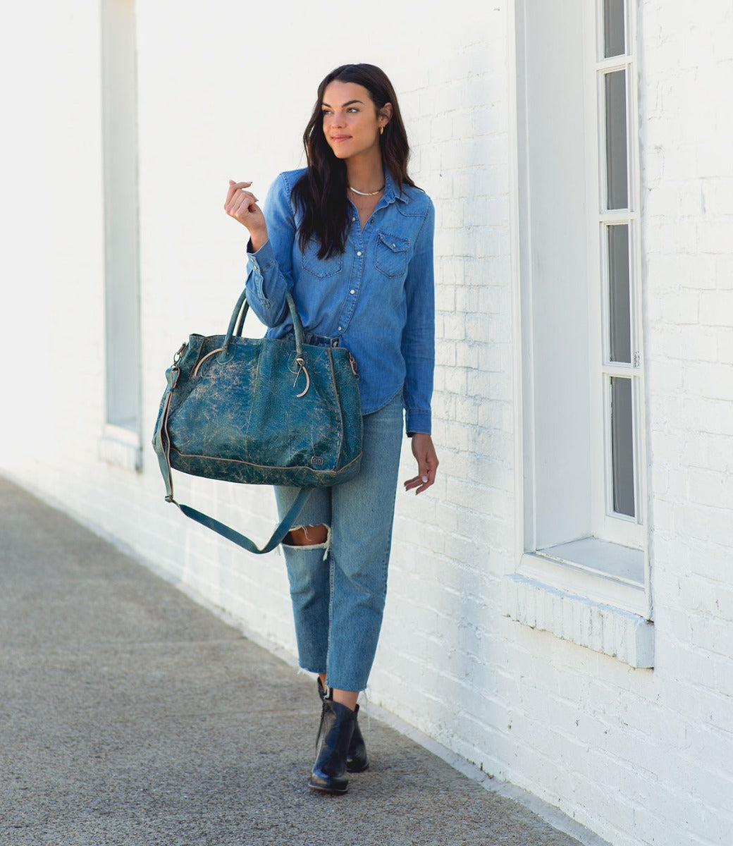 A woman wearing jeans and Isla boots by Bed Stu.