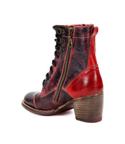 Side view of a red and black leather Bed Stu Judgement boot with laces and a zipper, featuring an iconic design and a comfortable wooden heel.