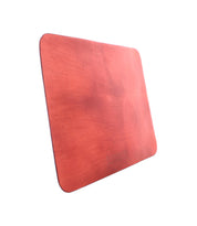 A rectangular, reddish-brown leather Launcher Mouse Pad with rounded corners and a soft suede underside by Bed Stu, perfect for a curated workspace.