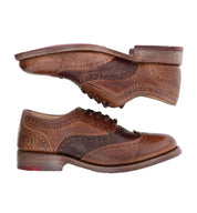 A pair of Bed Stu brown wingtip oxford shoes.