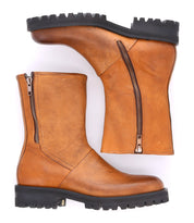 A pair of tan Bed Stu Italian leather boots with zippers known for their durability.