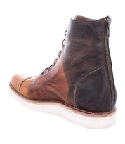 A Protege Light boot by Bed Stu, with a side zipper, lace-up front, and a white rubber sole, featuring cushioned leather insoles, photographed on a white background.