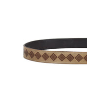 The Bed Stu Roam belt, a sophisticated accessory, features a beige leather design with geometric brown diamond patterns that evoke an Aztec vibe, beautifully isolated on a white background.