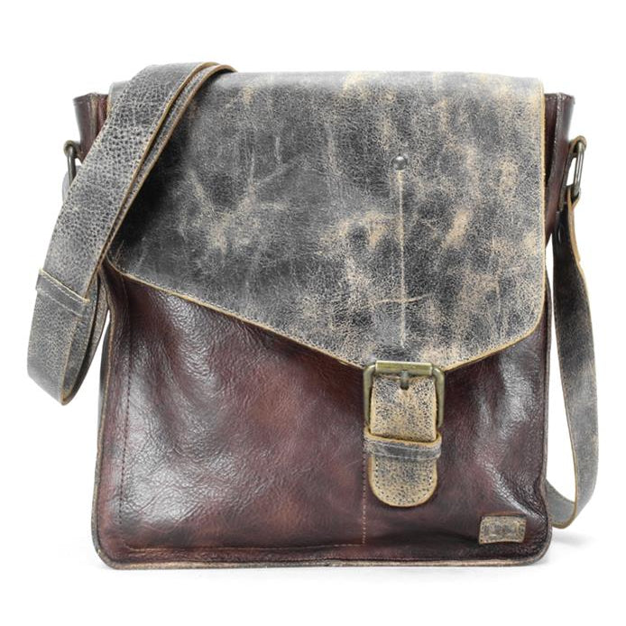 Introducing the Venice Beach by Bed Stu, a handcrafted leather crossbody bag with a distressed finish. This vintage-inspired piece showcases a buckle closure and adjustable strap, marrying timeless elegance with bohemian flair.