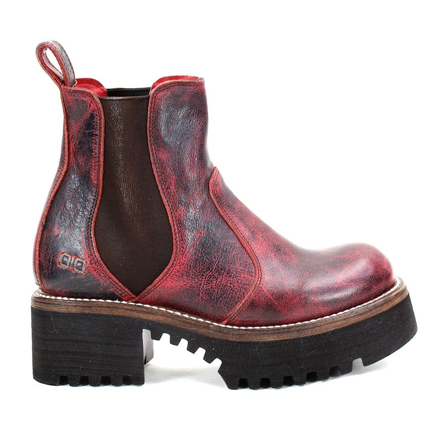 The Valda Hi by Bed Stu is a red leather Chelsea boot that features a chunky black rubber platform sole, a convenient pull tab on the back, and elastic side panels for effortless slip-on.