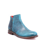 A single turquoise leather ankle boot by Bed Stu from the Yurisa collection, featuring a brown Vibram outsole, a slightly worn texture, and a red interior lining.