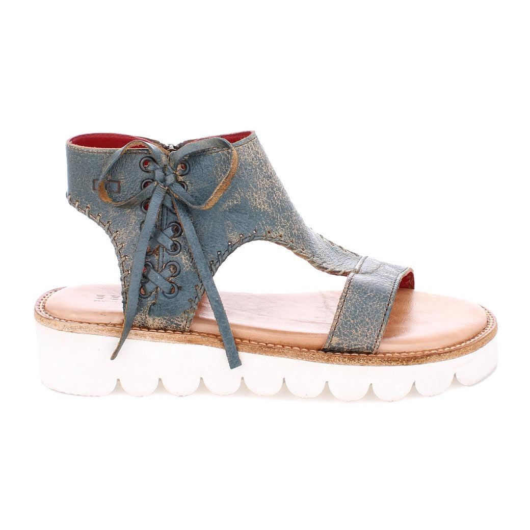 A women's Zoe II blue leather sandal with white soles by Bed Stu.